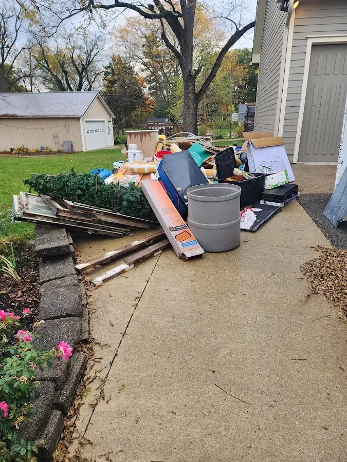 Dumpster being loaded with debris for 3 Yard Dumpster Rental in Silver Lake